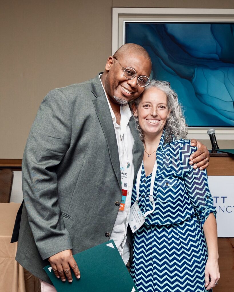 Colleagues from the American Epilepsy Society (AES) annual meeting in Orlando, Florida hugging