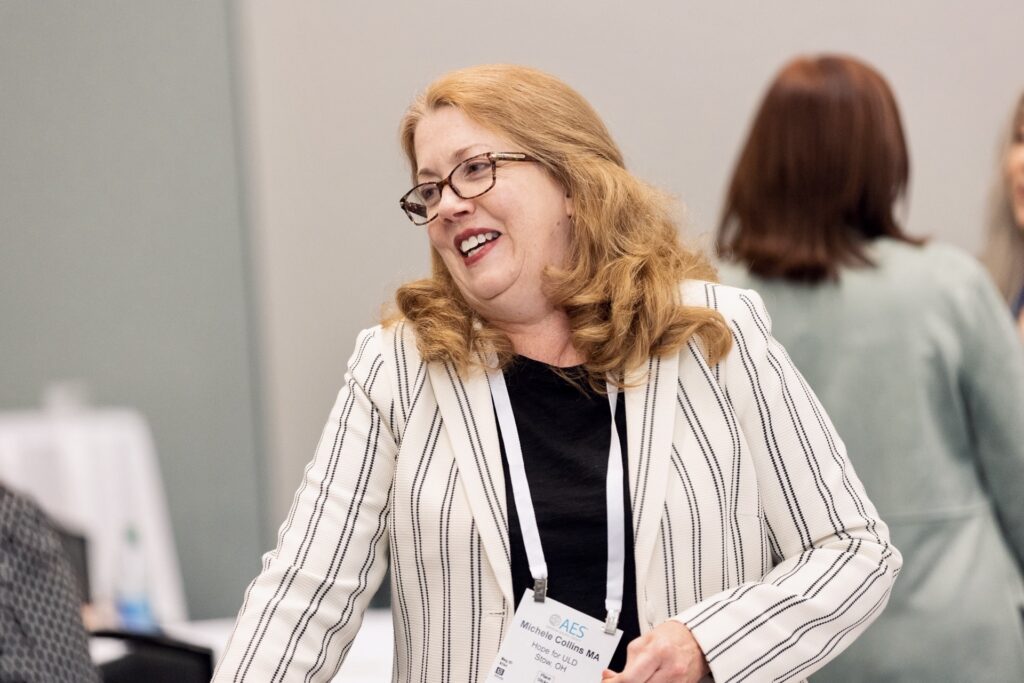 Michele Collins smiling at the AES conference in Nashville Tenessee